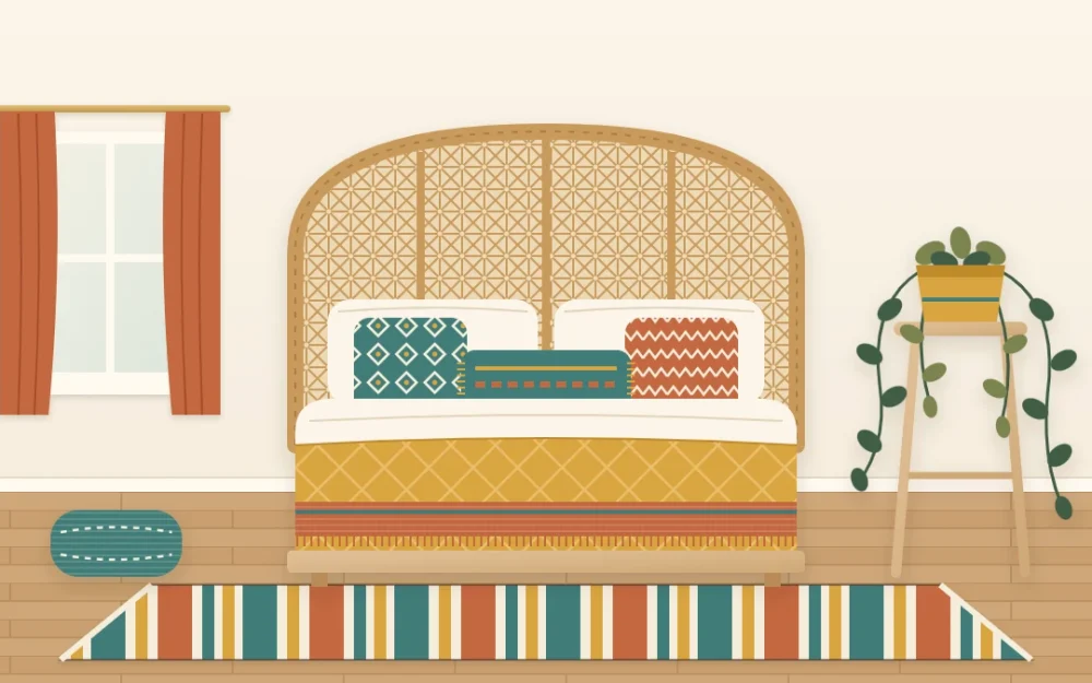 Colorful boho bedroom with cream walls, a mustard quilt, teal and terracotta pillows, a striped rug and a rattan headboard