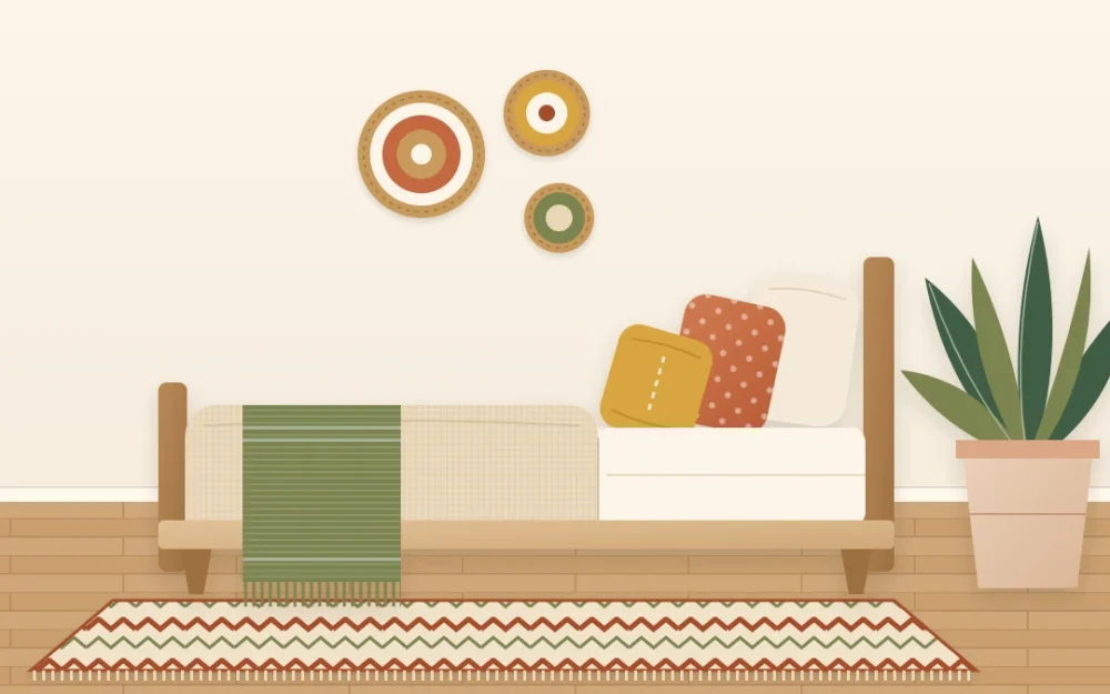 Boho bed corner in an earth-tone palette with a cream wall, sand bedding, terracotta and ochre pillows, an olive throw and a rust-patterned rug