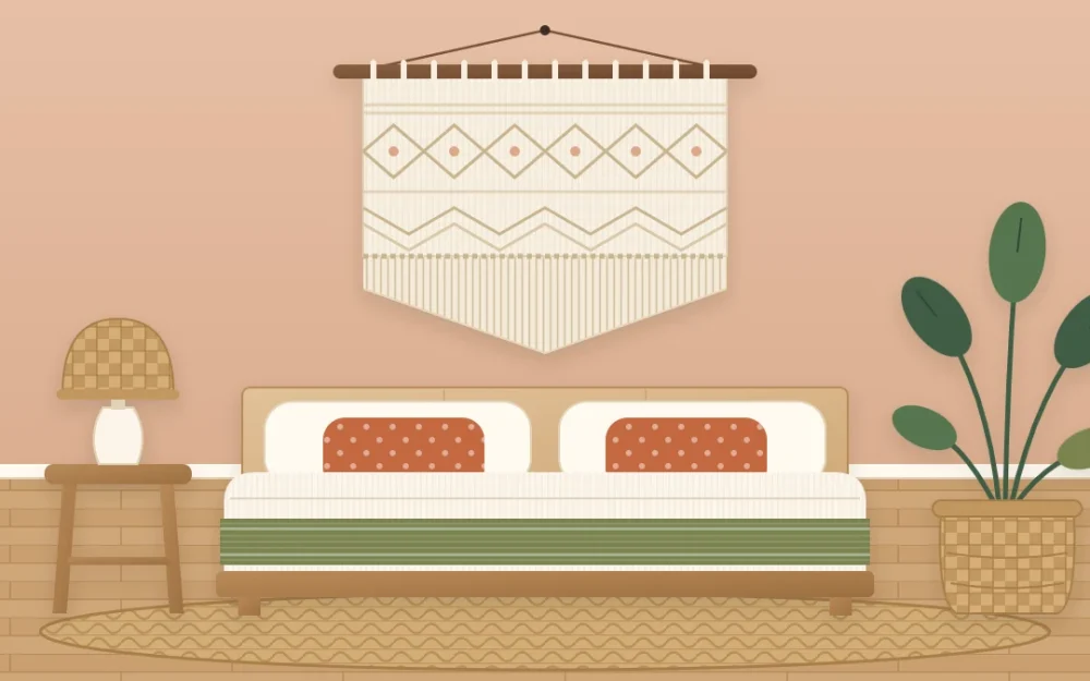 Large cream woven wall hanging with knotted fringe on a wooden rod, centered above a low bed with a wooden headboard and terracotta pillows